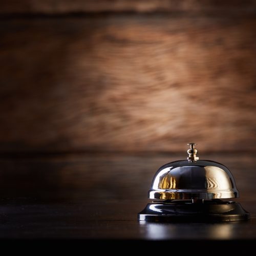 Call bell for service on wood background